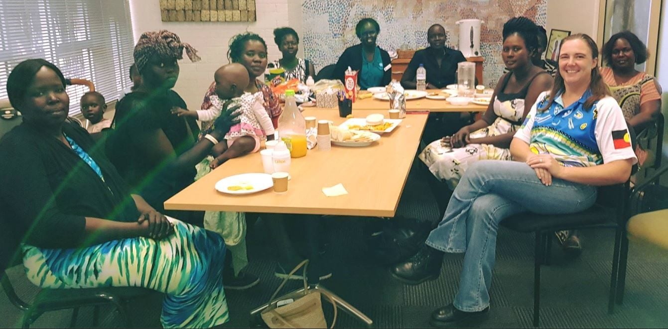 Group of women from South Sudan sitting around a table as part of the BLESS program by CatholicCare Toowoomba.